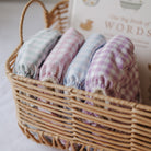 Gingham reusable nappies in pastel colours rose, blue, green and lilac