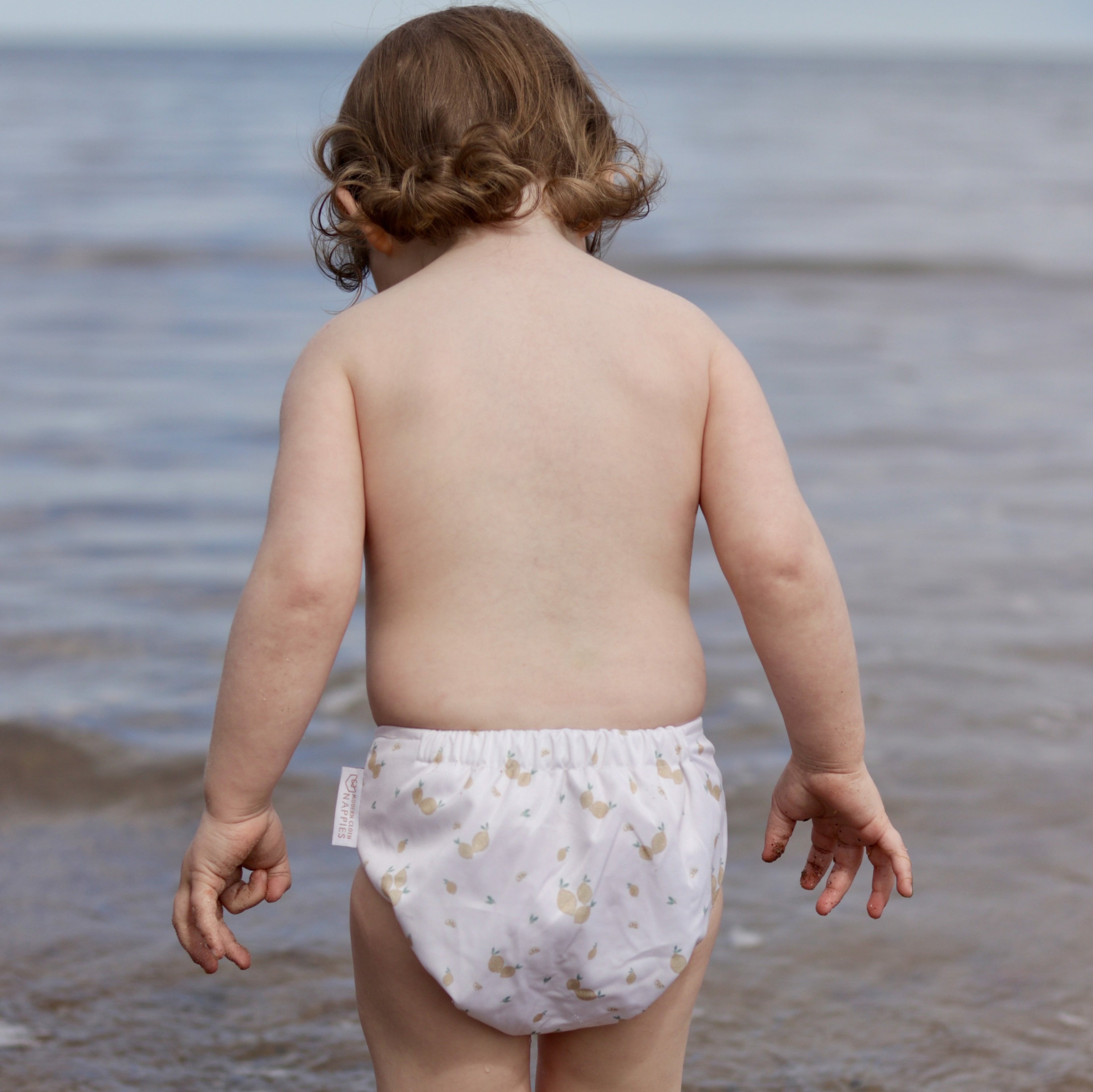 reusable swim nappy at the sea