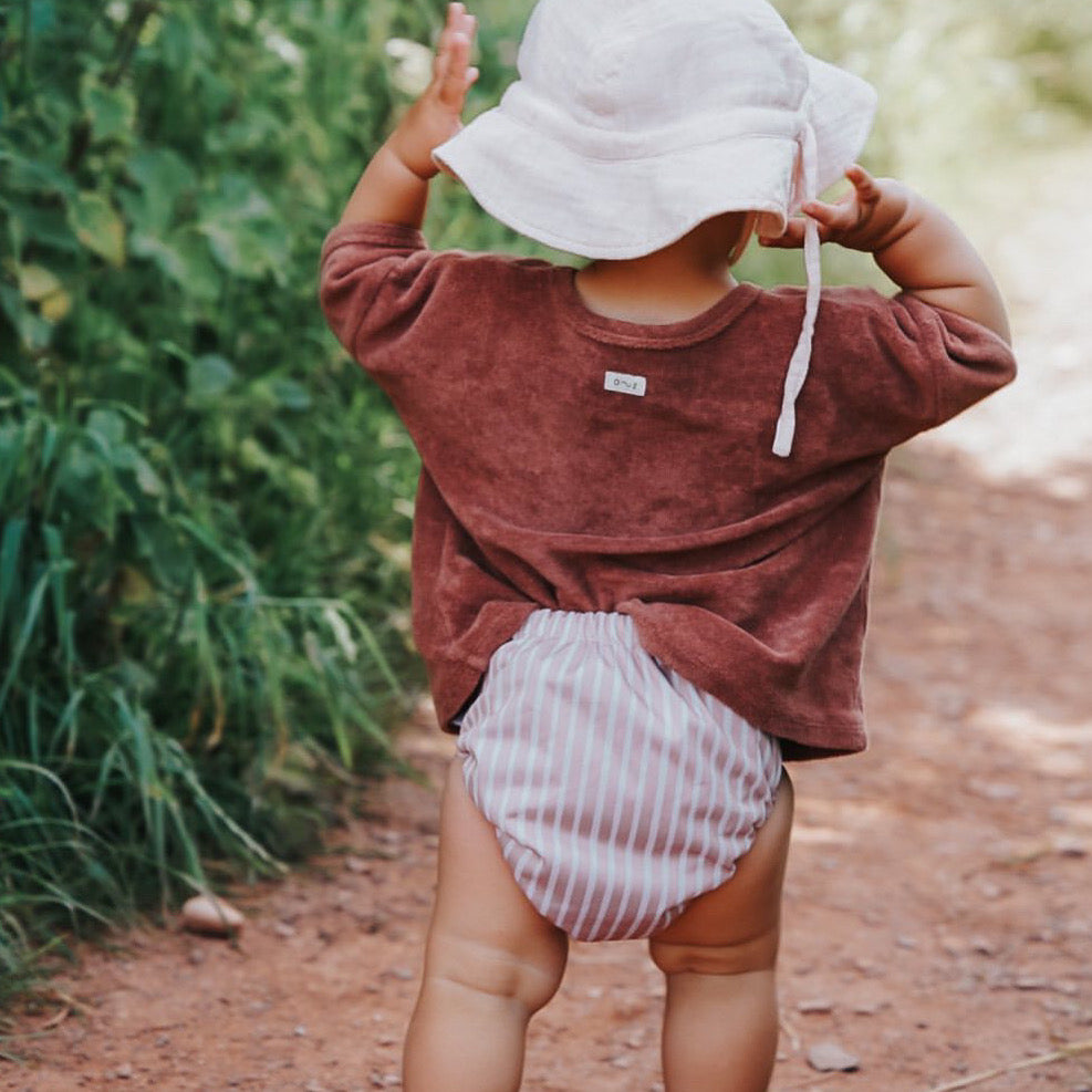 reusable swim nappy with terracotta stripes